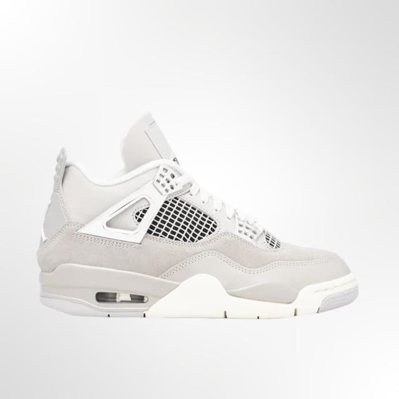 May include: Light grey and white athletic shoe. The shoe features a mesh panel, a white midsole, and a light grey suede upper. The shoe has a high-top design with a padded collar and tongue. The outsole is white and grey.