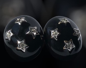 Pendientes de clip con estrella esmaltada en negro vintage firmados por COURREGES Paris