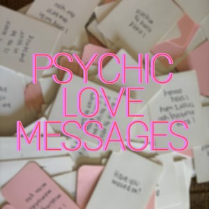 May include: A pile of small white cards with handwritten messages on them. The cards are scattered on a brown surface. The text "PSYCHIC LOVE MESSAGES" is written in pink letters on top of the cards.