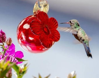 Hummingbird feeder. Hand-blown glass, made in Mexico. Red with white spots. Outdoor use.