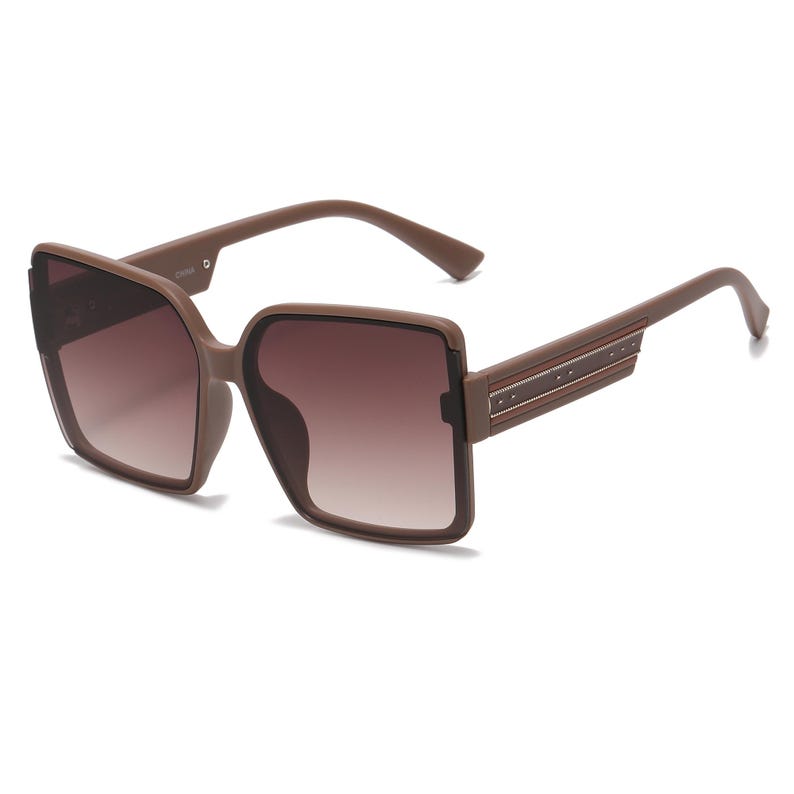 May include: Brown square sunglasses with gradient lenses. The sunglasses have a thick frame and arms with a decorative stripe. The lenses transition from a darker shade at the top to a lighter shade at the bottom.