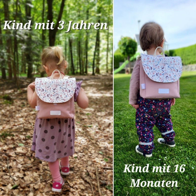 May include: Two children wearing pink backpacks with floral patterns. The backpack is worn by a child in a pink polka dot dress and a child in blue and black patterned pants. The text "Kind mit 3 Jahren" is visible above the child in the dress and the text "Kind mit 16 Monaten" is visible below the child in the pants.