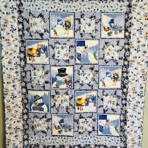 Schneemann und Freundquilt.  Misst ungefähr 64 X 83 Zoll.