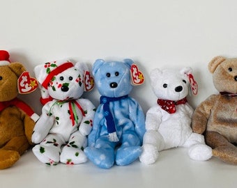 May include: Five plush beanie baby bears in various colors and patterns. The bears are wearing holiday-themed accessories, including a Santa hat, a scarf, and a holly-patterned hat.