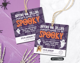 May include: Two Halloween-themed real estate tags with the text "Buying or Selling Doesn't Have to be Spooky." The tags feature a purple background with ghost illustrations and the agent's contact information.
