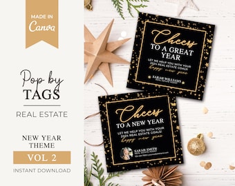 May include: Two black and gold New Year's greeting cards with gold glitter and stars. The text on the cards reads "Cheers to a Great Year" and "Cheers to a New Year". The cards are perfect for real estate agents to give to clients.
