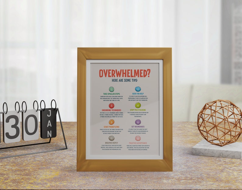 May include: A gold framed motivational poster with the text "Overwhelmed? Here are some tips:" and a list of tips for managing stress and overwhelm. The tips include taking smaller steps, seeking help, grounding techniques, setting boundaries, and practicing acceptance.