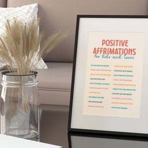 May include: A framed print with the words "POSITIVE AFFIRMATIONS for kids and teens" in red and blue. The print lists affirmations such as "I am beautiful inside and out" and "I have courage and confidence."