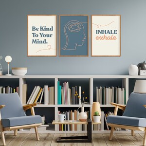 May include: Three framed wall art prints with inspirational quotes. The first print reads "Be Kind To Your Mind." The second print features a line drawing of a head. The third print says "Inhale exhale." The frames are brown.