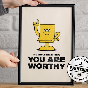 Puede incluir: Un p&oacute;ster digital enmarcado con un borde negro. El p&oacute;ster presenta un personaje de nota adhesiva amarillo, de dibujos animados, con un dedo levantado. El texto dice: "A GENTLE REMINDER: YOU ARE WORTHY". Un gr&aacute;fico circular dice "DOWNLOAD PRINTABLE DIGITAL POSTER".