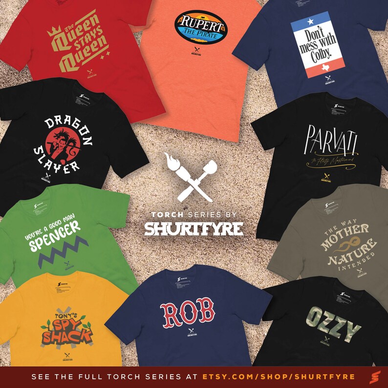 May include: A collection of ten t-shirts with various designs and colors. The shirts feature text and graphics, including "The Queen Stays Queen", "Rupert the Pirate", "Don't Mess with Colby", "Dragon Slayer", "You're a Good Man Spencer", "Tony's Spy Shack", "Rob", "Parvati", "The Way Mother Nature Intended", and "Ozzy".