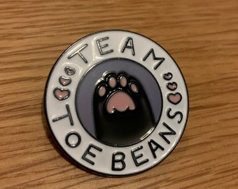 Team toe beans pin badge