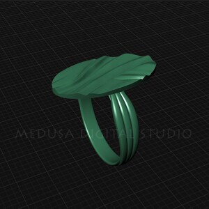 Pu&ograve; includere: Un anello verde con una parte superiore ondulata di forma organica. L'anello &egrave; in metallo e ha una finitura liscia e lucida.