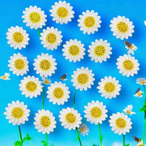 May include: A collection of embroidered daisy patches featuring white petals and yellow centres arranged against a bright blue background, interspersed with small, detailed butterfly motifs and thin green stems.
