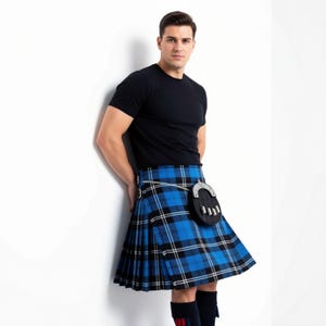 Rust-free silver buckles on a personalized Ramsay kilt, traditionally worn with a Sgian Dubh tucked into the kilt hose.