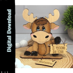 May include: Wooden moose figurine holding a sign that says "It moose be love" and sitting on a wooden base with a sign that says "Welcome".