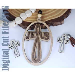 May include: Wooden Jesus cross pendant with the word "Jesus" cut out. The pendant is light brown and has a layered design. Two smaller cross charms and a wooden bead strand are also visible.