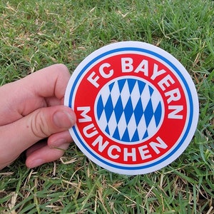 May include: A red, white, and blue circular sticker with the text "FC Bayern Munchen".