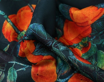 May include: Close-up of a dark green fabric with a repeating pattern of orange fruit and green leaves.