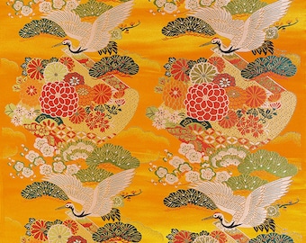 May include: A repeating pattern of white cranes flying over a yellow background with red, orange, and green floral designs.