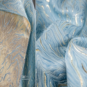 Guld- och ljusblått jacquardtyg: 3D-texturerad oljemålningsdesign, 137 cm bred