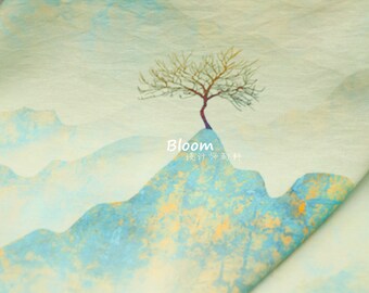 May include: A light green fabric with a watercolor design of a tree on a mountain with the text "Bloom" and Chinese characters.