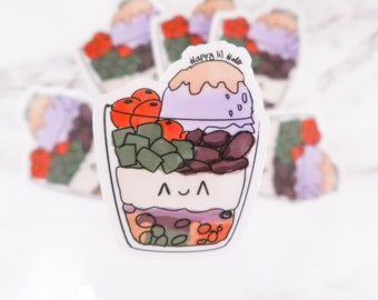 May include: A colorful sticker featuring a cartoon illustration of a layered dessert, possibly halo-halo. The dessert includes purple ice cream, red fruit, green jelly, and beans. The sticker has the text "Happy lil Halo".