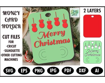 May include: A green card holder with a cut-out design of red ornaments and the text "Merry Christmas". The card holder has two slots for money or gift cards. The image also shows a red card holder and a green card holder with a cut-out design of ornaments and the text "Merry Christmas".