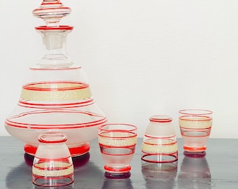 Atomic 1950s enamelled clear blown glass decanter set, red and gold banded decoration