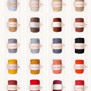 May include: A collection of twenty cylindrical spools of macrame cord in various colors, including shades of blue, beige, brown, gray, black, yellow, orange, and red. Each spool features a white paper label with the text All For Knotting.