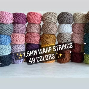 May include: A collection of 49 colorful 1.5mm warp strings, arranged in rows. The strings are made of cotton and are perfect for weaving, macrame, and other crafts.