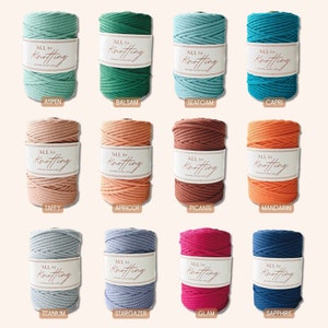 May include: Twelve spools of cotton rope in various colors, including teal, green, orange, brown, blue, and pink. Each spool has a white label with the text "ALL for Knotting" and the color name.