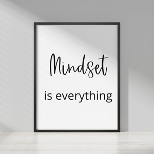 May include: A black framed print with white background and black text that reads "Mindset is everything".