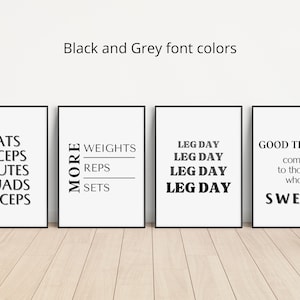 May include: Four framed prints with black frames and white backgrounds. The prints feature black and gray text with motivational fitness phrases: LATS, BICEPS, GLUTES, QUADS, TRICEPS; MORE WEIGHTS REPS SETS; LEG DAY; GOOD THINGS come to those who SWEAT.
