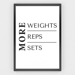 May include: A framed print with a white background and black text. The word "MORE" is vertically aligned on the left. The words "WEIGHTS", "REPS", and "SETS" are horizontally aligned on the right, separated by lines. The frame is black.