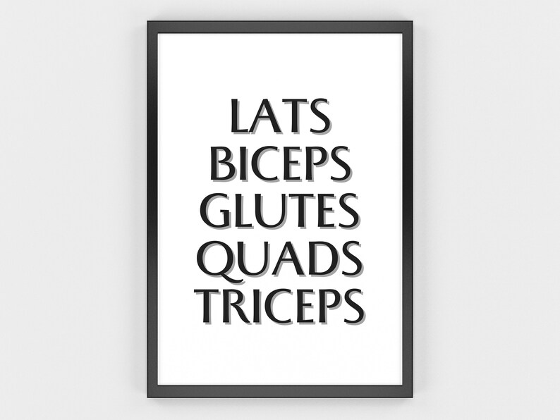 May include: Black framed print with the words LATS, BICEPS, GLUTES, QUADS, and TRICEPS in a bold, sans-serif font. The text is in black with a subtle shadow effect, set against a white background.