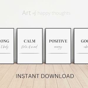 May include: Four black framed prints with white backgrounds and black text. The prints read "Strong mind & body", "Calm state of mind", "Positive energy", and "Good vibes". The text is in a handwritten font. The prints are arranged in a row on a light wood surface. The text "Art of happy thoughts" is above the prints. The text "INSTANT DOWNLOAD" is below the prints.
