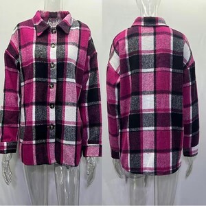 May include: A pink, black, and white plaid shirt jacket with a button-down front and collared neckline. The jacket features a classic plaid pattern and long sleeves. The image shows both the front and back of the jacket.