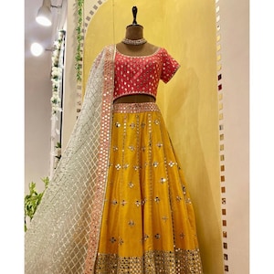 Yellow indian wedding lehenga with contrast pink blouse with mint green Chanderi dupatta