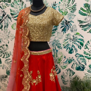 Red sequins embroidered wedding lehenga with sequins embellished blouse and scalloped dupatta