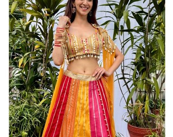 Bright multi color indian wedding gotta embellished lehenga paired with boho blouse and  flowy mesh cape mehendi sangeet outfit