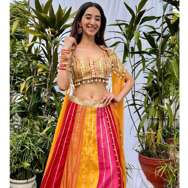 Bright multi color indian wedding gotta embellished lehenga paired with boho blouse and  flowy mesh cape mehendi sangeet outfit