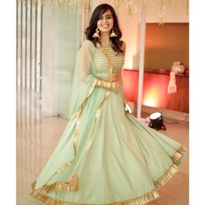 Mint green chanderi bridesmaid wedding stitched lehenga with sequins and beads embroidered blouse and matching dupatta with border