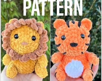 May include: Two crocheted stuffed animals, a lion and a tiger, are shown in a close-up image. The lion is yellow with a brown mane and the tiger is orange with black stripes. Both animals have black eyes and a white patch on their chest. The image is labeled "PATTERN" at the top.