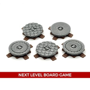 May include: Five grey plastic sewer covers with brown plastic bases. The covers have different designs, including a grid pattern and a circular pattern.  The covers are arranged in a semi-circle on a white surface.  NEXT LEVEL BOARD GAME is printed in red on a white background.