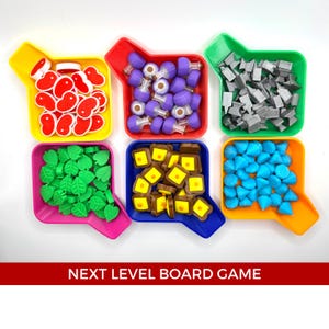 May include: Six colourful trays with different coloured game pieces. The trays are yellow, red, blue, green, orange, and pink. The pieces are red hearts, purple potion bottles, grey metal pieces, green leaves, brown and yellow bread pieces, and blue gems.