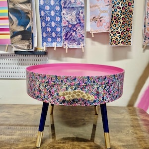 Round coffee table , ditsy floral, multicolour pink blue and green flower design. Round table, lift off top for storage. End table lounge