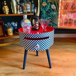 Black and white red check round bedside table. Checkerboard retro midcentury vibe Nightstand .