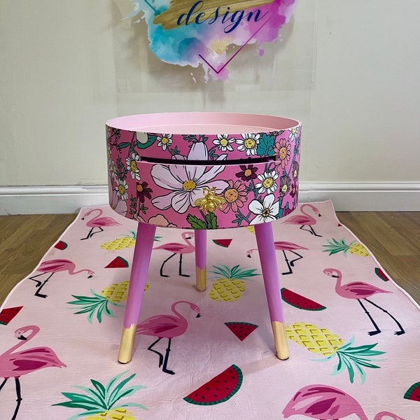 Pink round side table with floral design. Inbuilt drawer and three legs with bee handle. Boho decor. Flower wooden nightstand