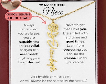 May include: A gold-colored necklace with a floral pendant and the name "Elizabeth" in script. The necklace is presented on a white card with text that reads "To My Beautiful Niece." The card also includes inspirational messages.